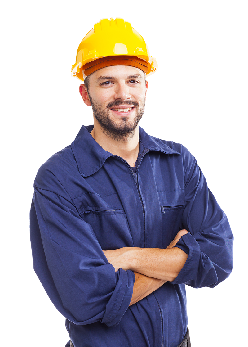 A man wearing a hard hat and blue overalls is standing with his arms crossed.